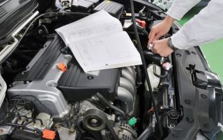 mechanic performing logbook service